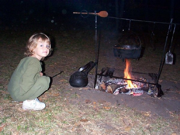 child and cooking fire
